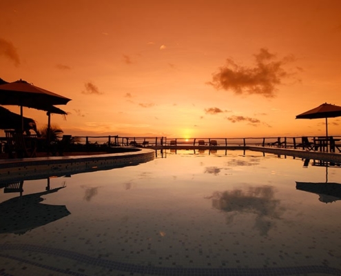 pool by sunset at the manta resort